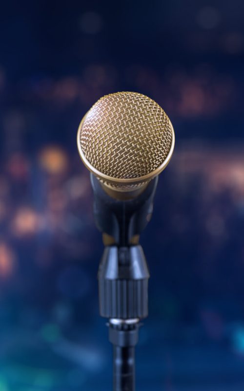 Golden microphone on stage during the concert Golden microphone on stage during the concert